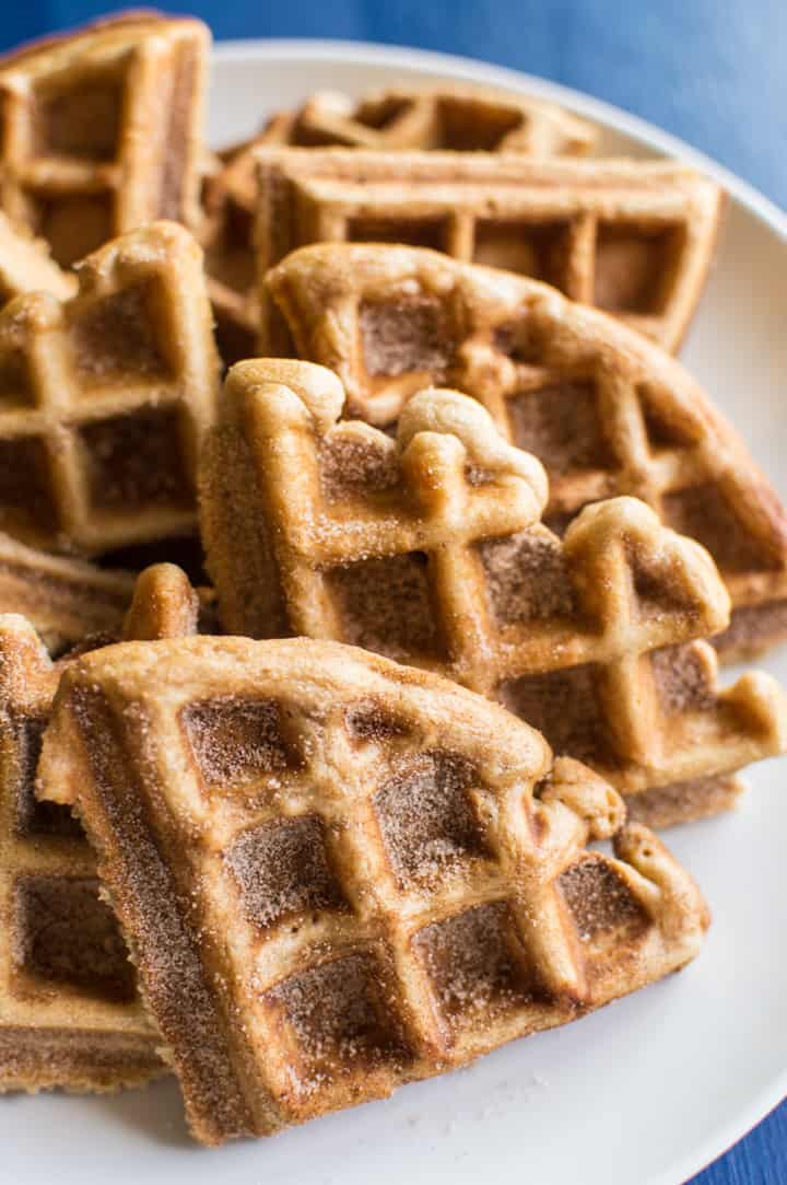 Churro Waffles with Cayenne Whipped Cream - delicious waffles sprinkled generously with cinnamon and sugar, and topped with a homemade cayenne cinnamon whipped cream. Perfect for brunch! | healthynibblesandbits.com