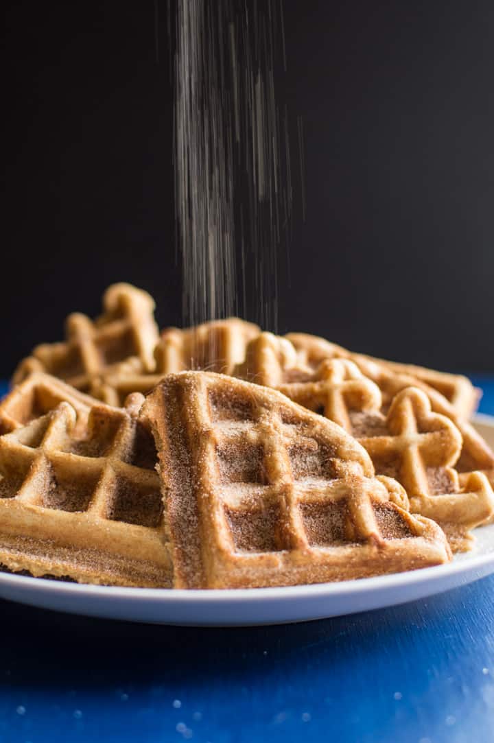 Churro Waffles with Cayenne Whipped Cream - delicious waffles sprinkled generously with cinnamon and sugar, and topped with a homemade cayenne cinnamon whipped cream. Perfect for brunch! | healthynibblesandbits.com