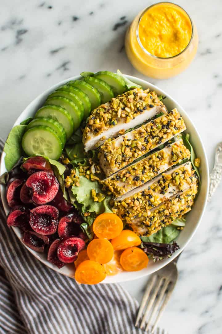 Pistachio Crusted Chicken Salad with Carrot Ginger Dressing - this gluten-free and paleo salad is perfect for weeknights. Ready in 30 minutes! | healthynibblesandbits.com