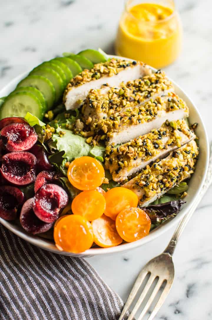 Pistachio Crusted Chicken Salad with Carrot Ginger Dressing - this gluten-free and paleo salad is perfect for weeknights. Ready in 30 minutes! | healthynibblesandbits.com