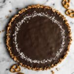 Five-Ingredient Chocolate Coconut Tart with Pretzel Crust - this rich gluten-free dessert is a must make for your next gathering! by Lisa Lin of Healthy Nibbles & Bits