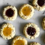 Easy Gluten-Free Coconut Thumbprint Cookies that are made with less than 10 ingredients! by Lisa Lin of healthynibblesandbits.com