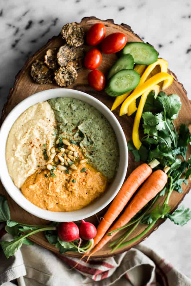 Perfect Hummus Three Ways - Roasted Garlic Hummus, Carrot Harissa Hummus, and Cilantro Jalapeno Hummus - it's a great protein-packed dip for pre- and post-workout! by @healthynibs