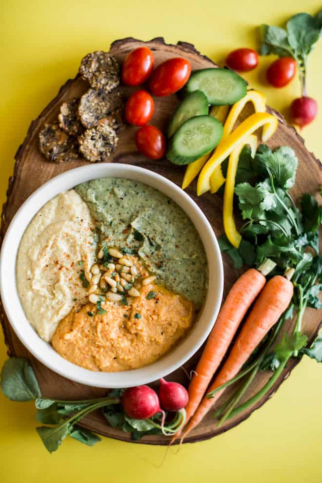 Perfect Hummus Three Ways - Roasted Garlic Hummus, Carrot Harissa Hummus, and Cilantro Jalapeno Hummus - it's a great protein-packed dip for pre- and post-workout! by @healthynibs