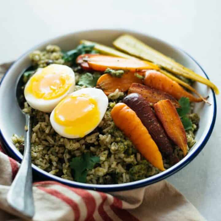 Rice Bowl with Green Chile Sauce, Roasted Carrots & Eggs - a hearty vegetarian fall meal by @healthynibs