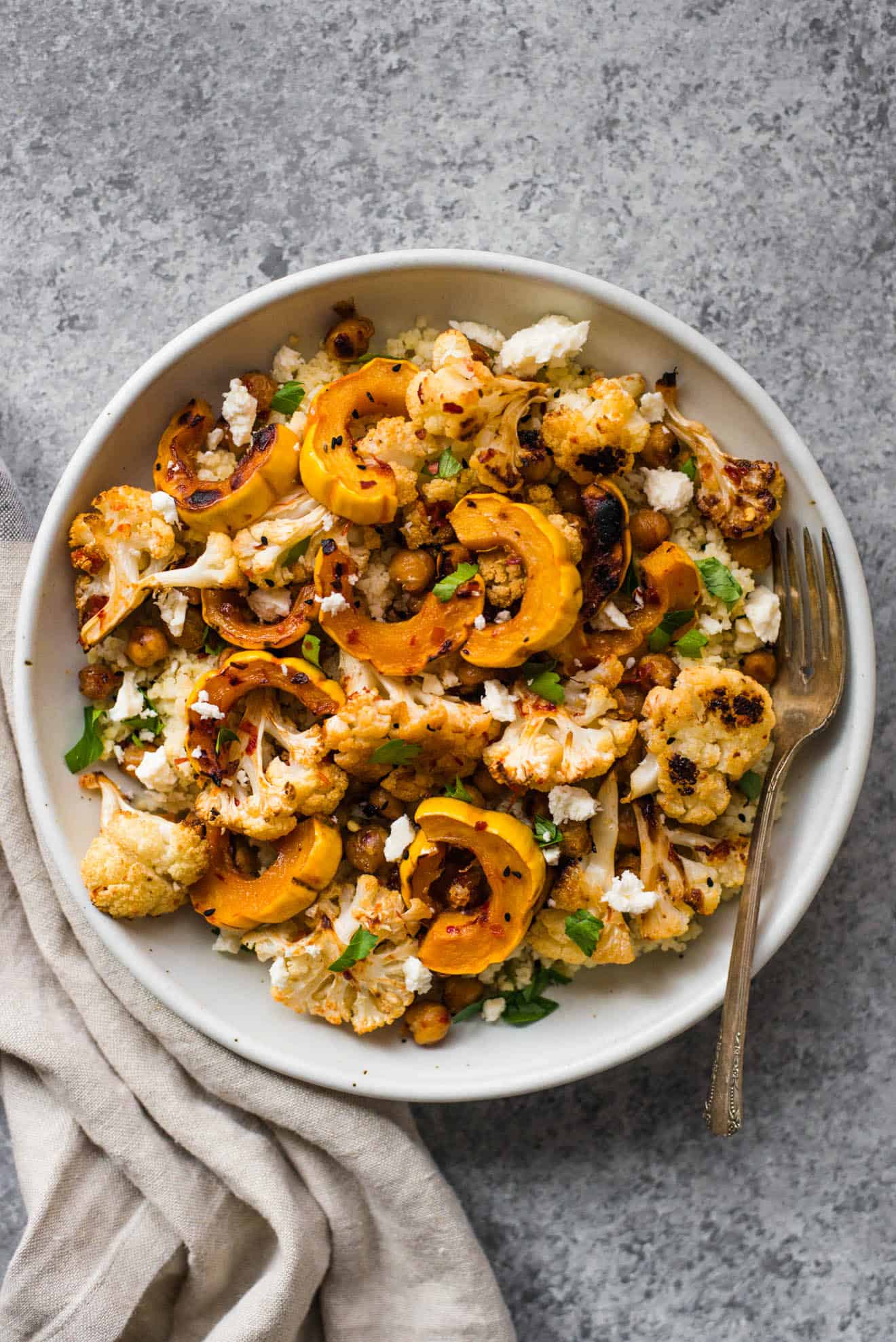 This Harissa Roasted Cauliflower with Delicata Squash & Chickpeas is a healthy, gluten-free weeknight dinner! Made with just 7 ingredients!