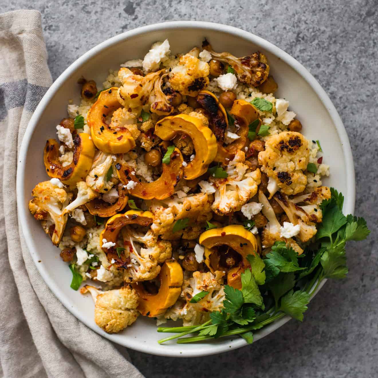 This Harissa Roasted Cauliflower with Delicata Squash & Chickpeas is a healthy, gluten-free weeknight dinner!