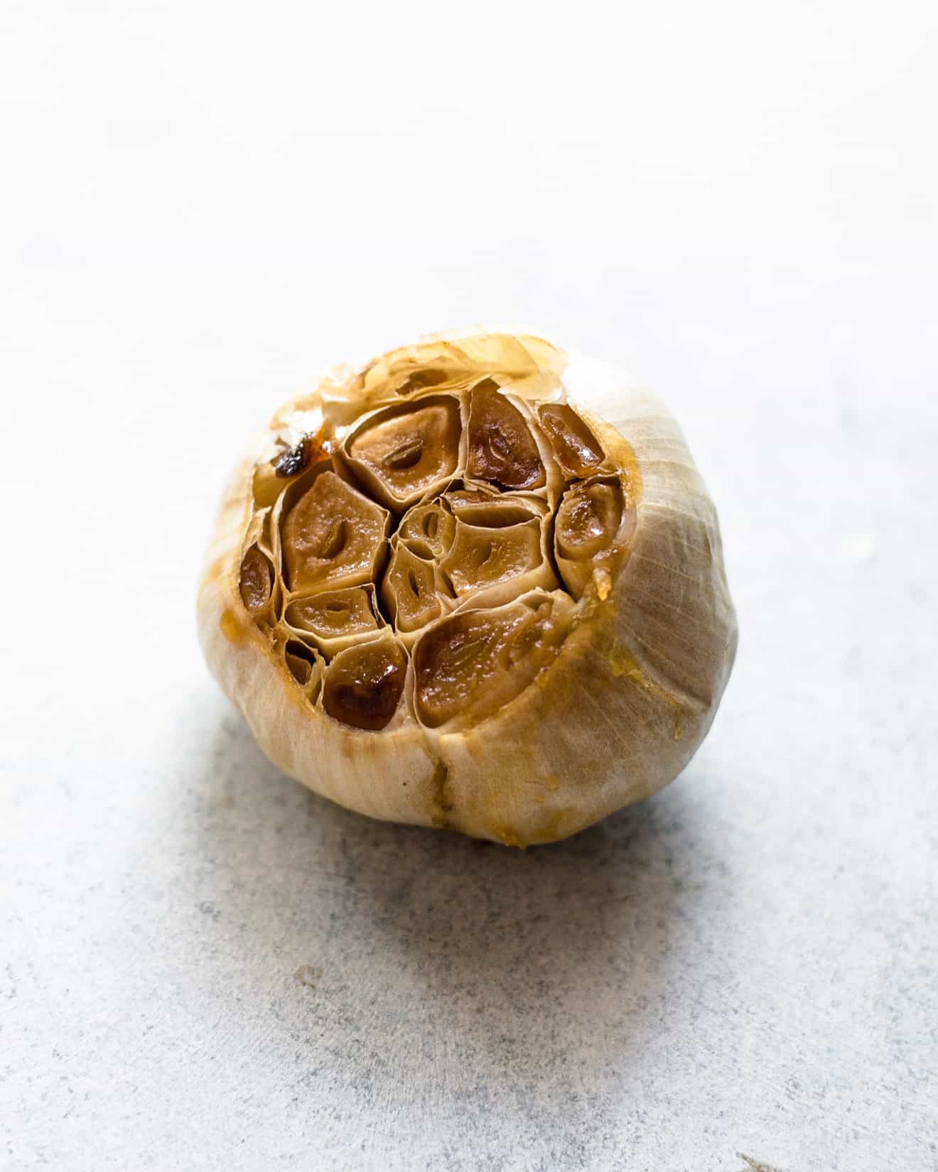 VIDEO TUTORIAL on how to roast garlic. Roasted garlic is great with roasted vegetables or mixed in dressings and hummus!