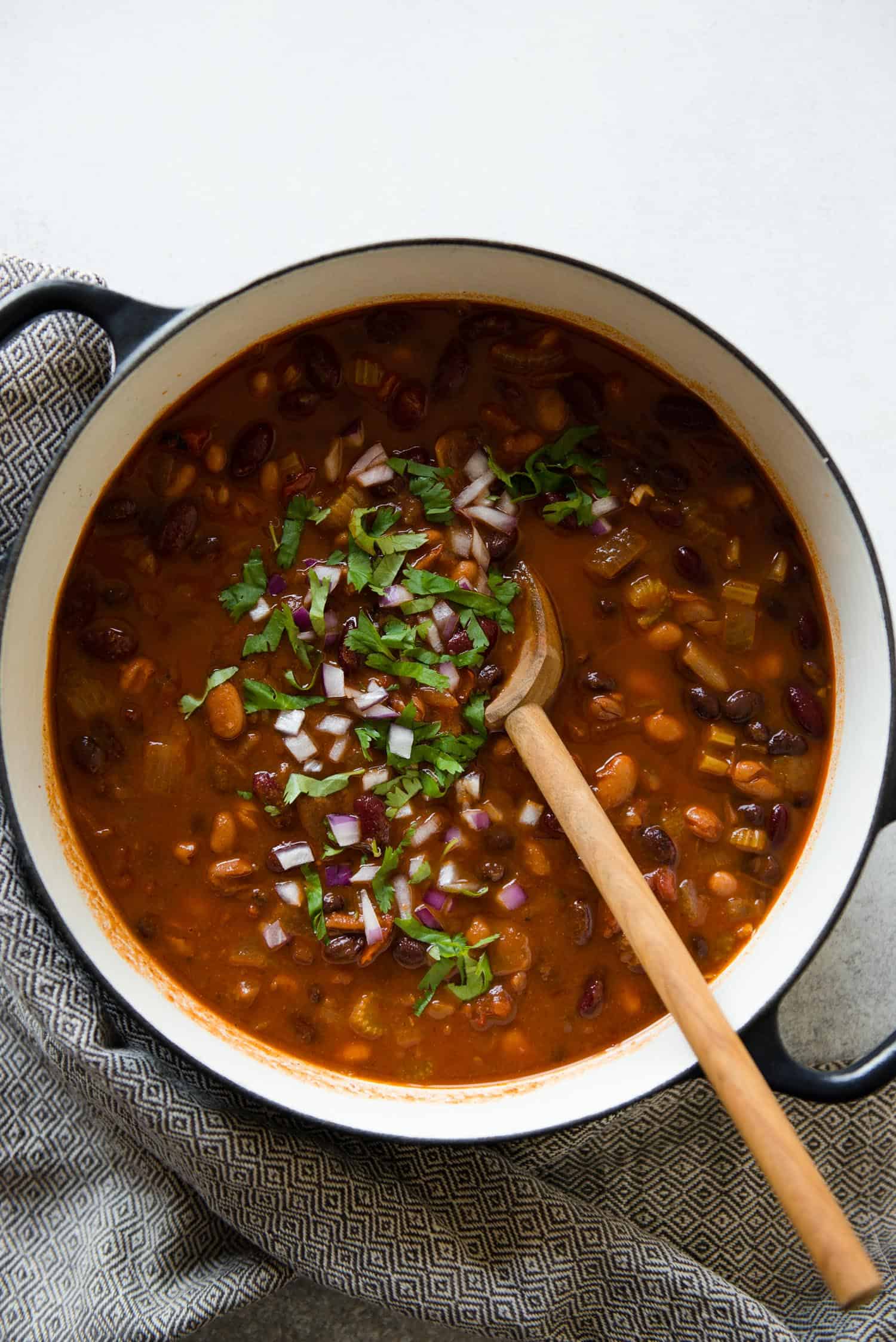 This hearty vegetarian three bean chili is packed with vegetable protein from three varieties of beans: chickpeas, kidney beans and black beans. 