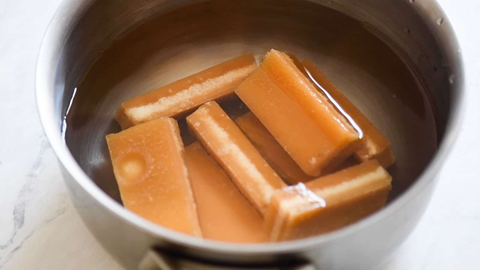 Brown sugar slabs in saucepan