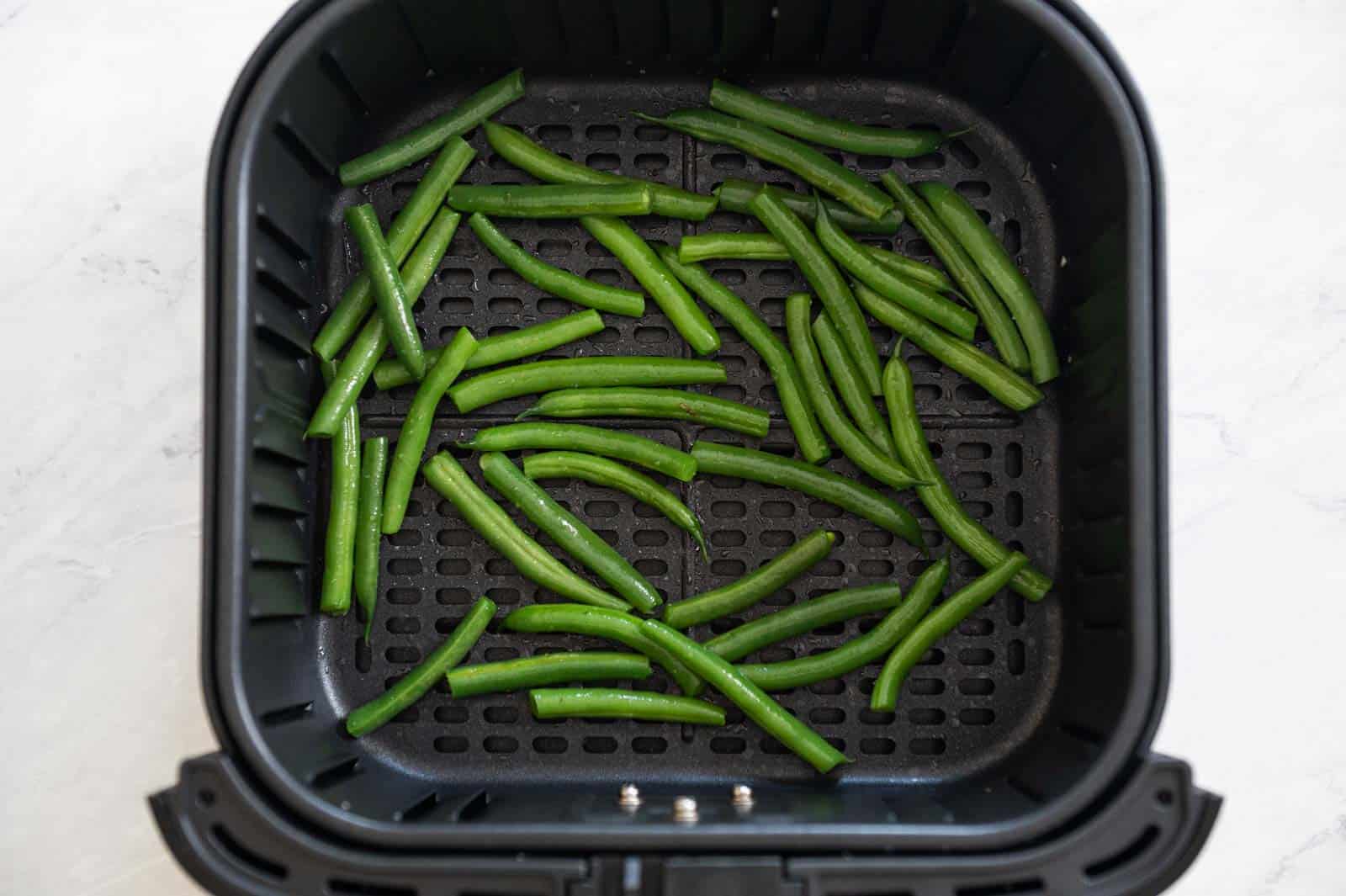 Green Beans in air fryer basket