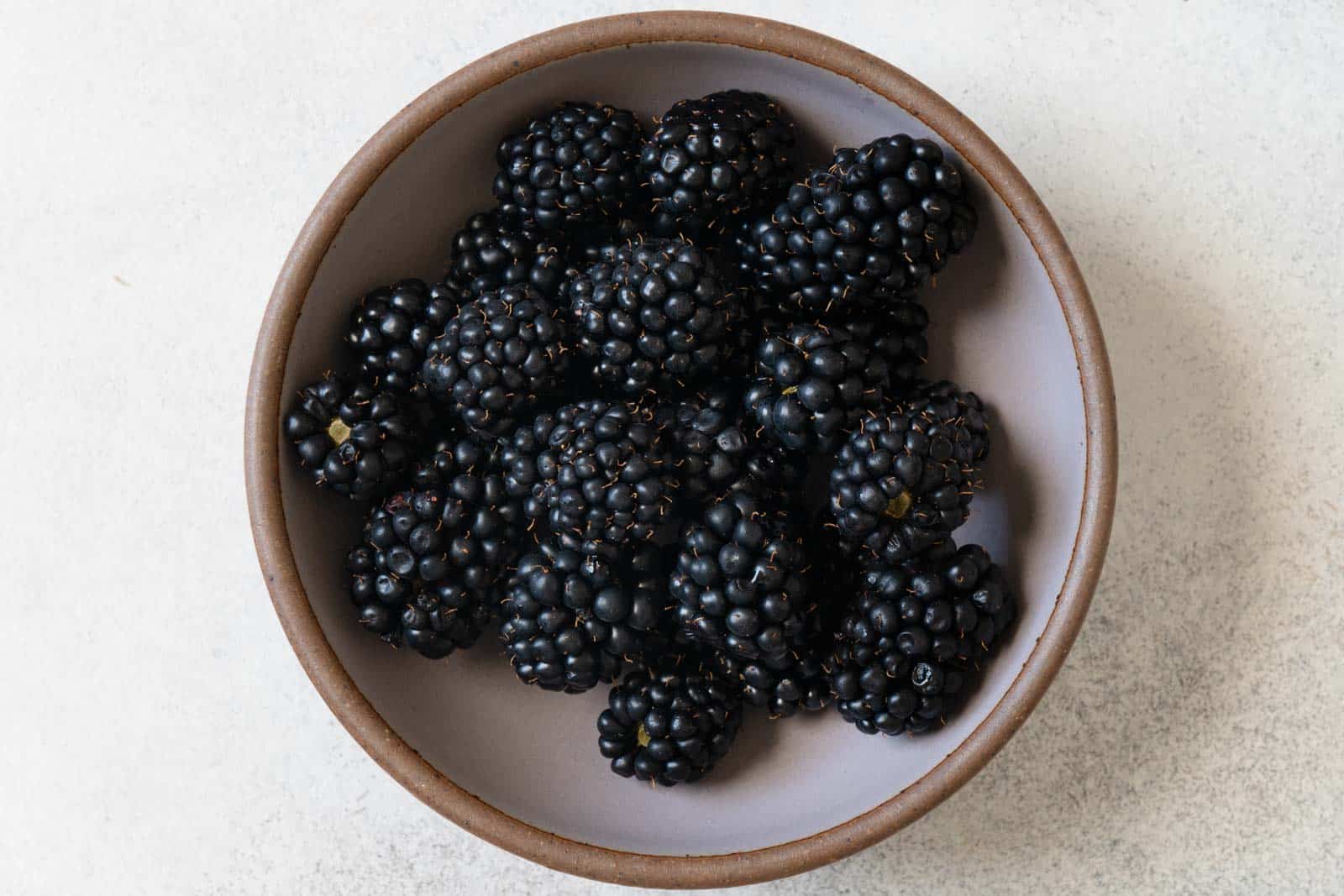 Blackberries in a bowl What's In Season: August Produce Guide What&#8217;s In Season: August Produce Guide Blackberries Landscape