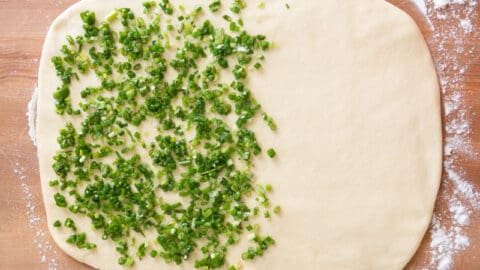 Covering Dough with Scallions